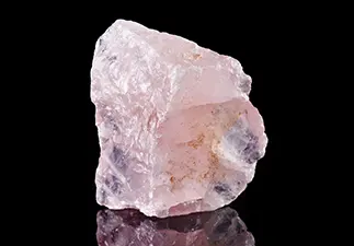 A rose colored quartz crystal.